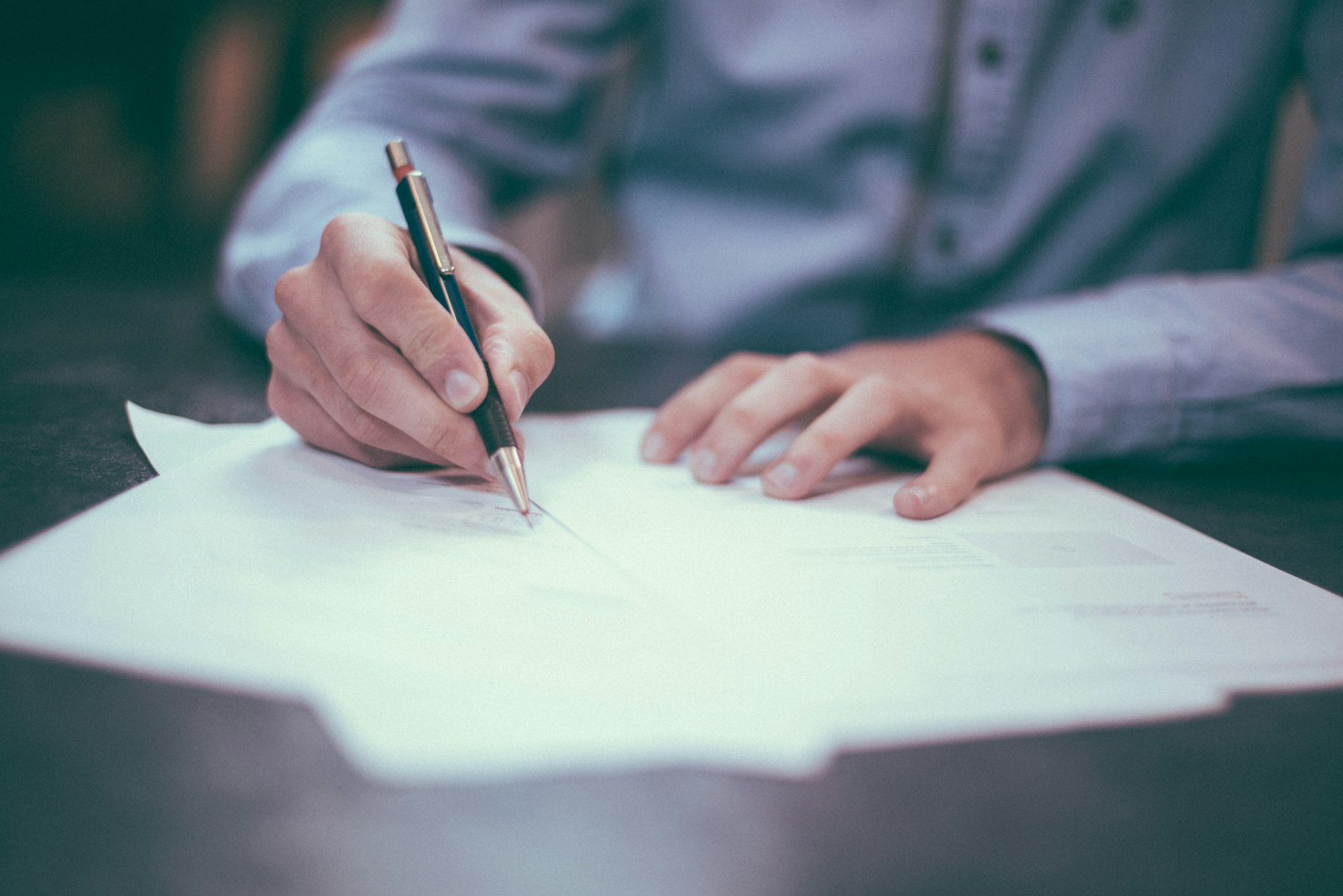 Contractor signing a renovation agreement