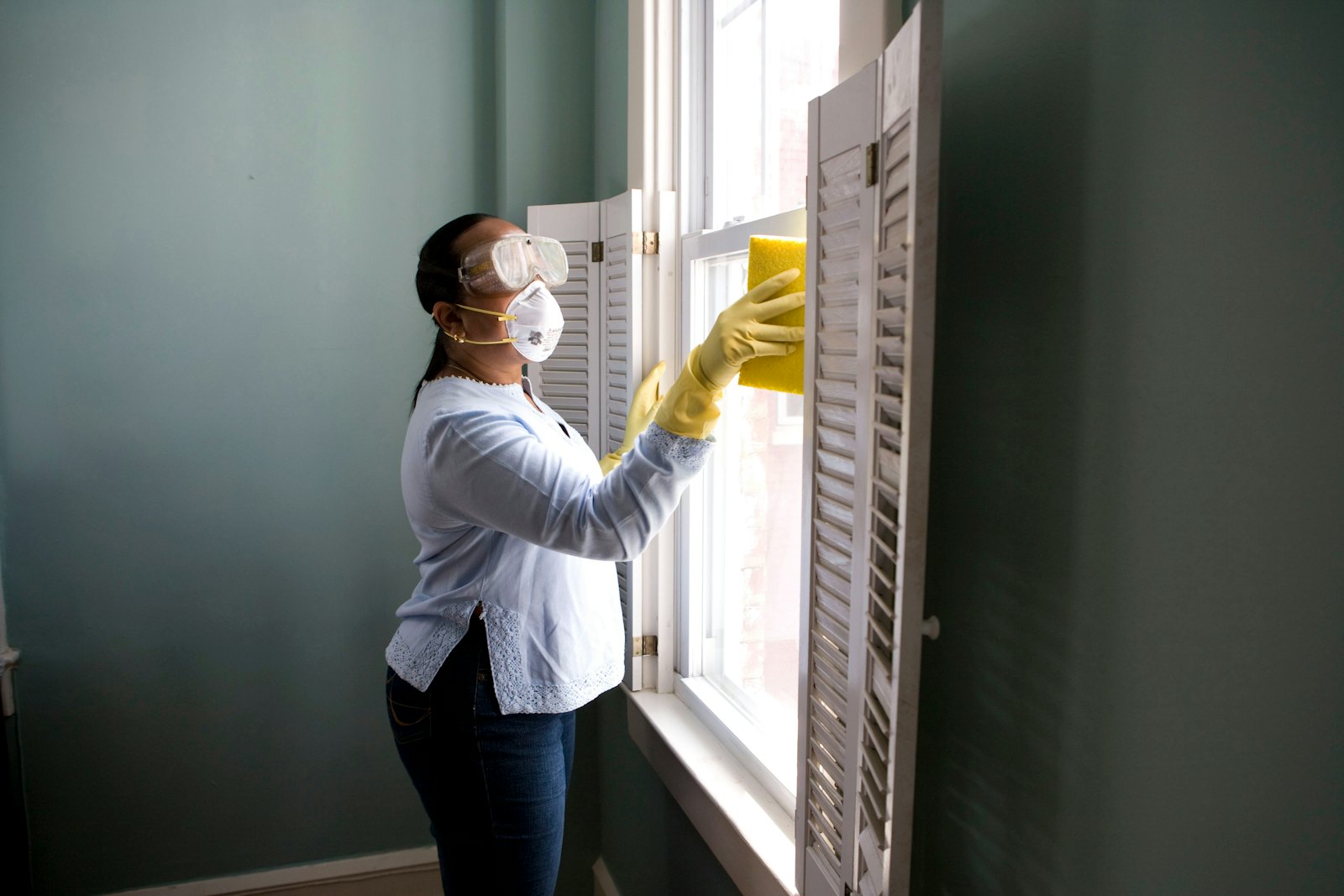 Contractor reviewing renovation schedule on a tablet