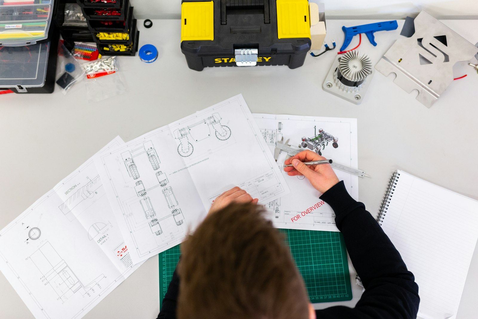 Renovation contractor reviewing drawings and a scope document